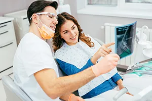 Dentist showing a patient her x-ray