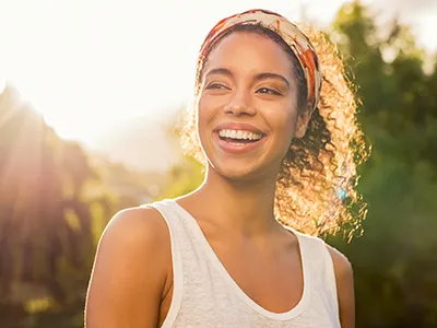 Woman smiling at sunset